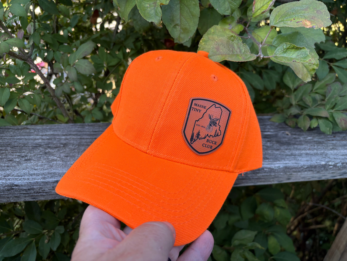 Maine Tiny Buck Club orange hat.