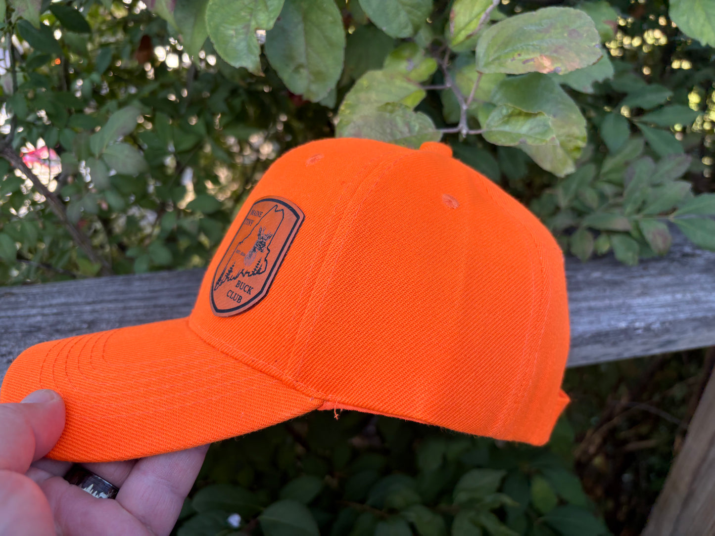 Maine Tiny Buck Club orange hat.